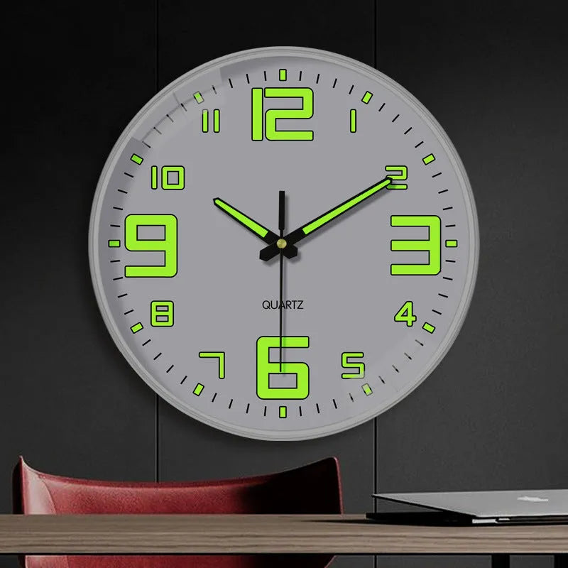 Modern 8 inch diameter luminous wall clock with plastic shell on a wall.