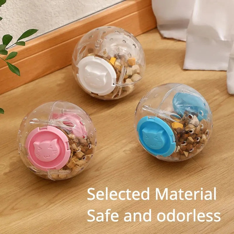 11.5cm blue ABS slow feeding ball for dogs and cats on a light background