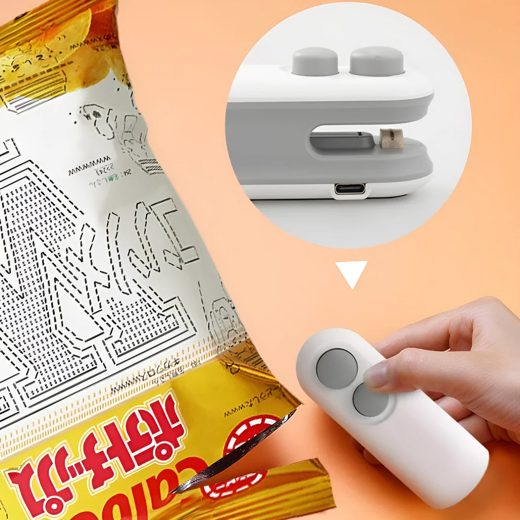 White handheld USB rechargeable heat sealer with cutter blade on a kitchen counter