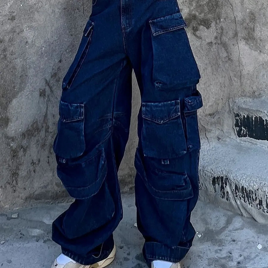 Women's dark blue distressed wide-leg high waist jeans with multiple pockets on a mannequin.