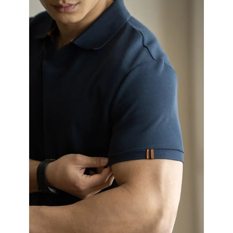 Men's short-sleeved blue polo shirt with a placket and collar, laid flat.