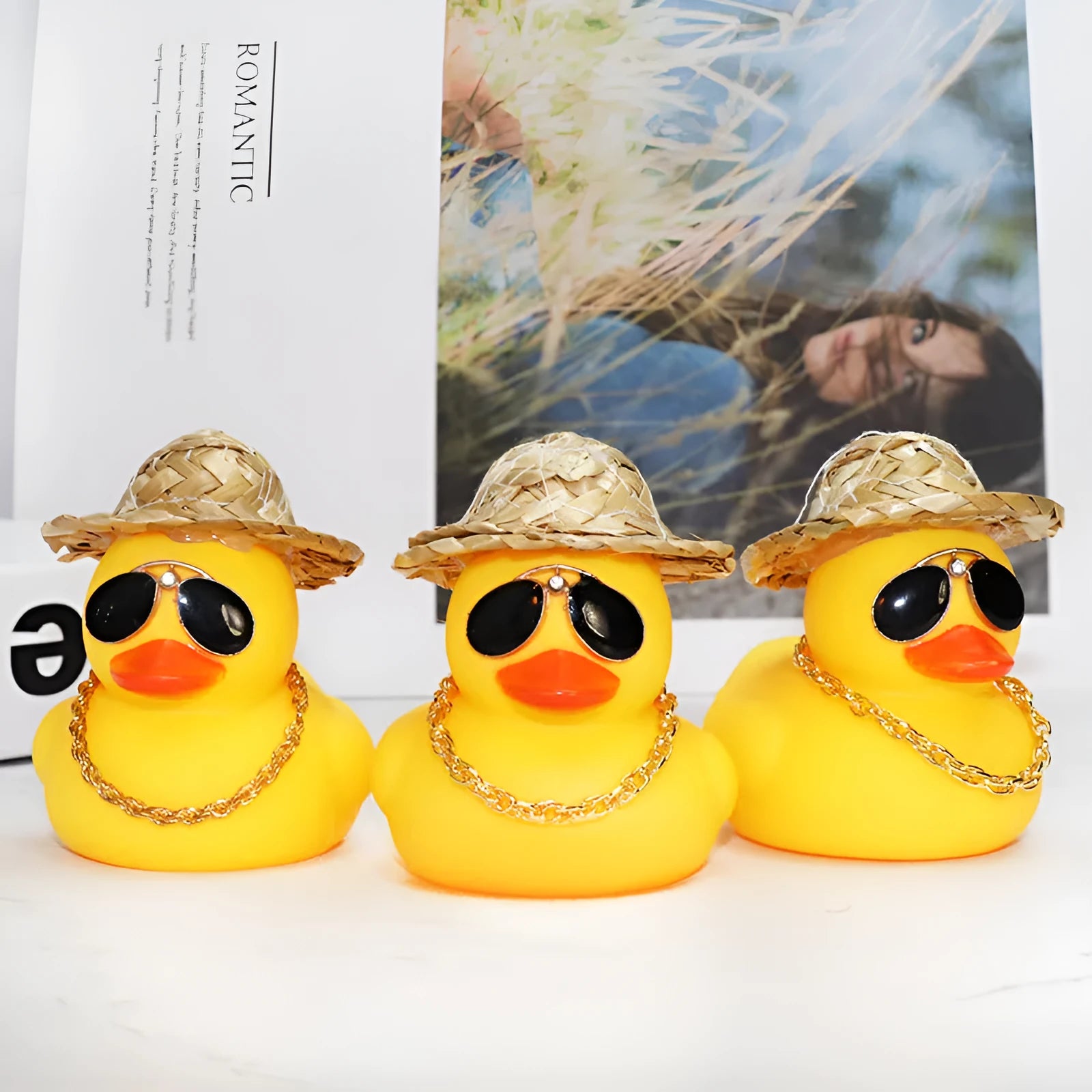 Straw hat yellow duck cartoon car dashboard ornament with adhesive gel and sunglasses necklace.