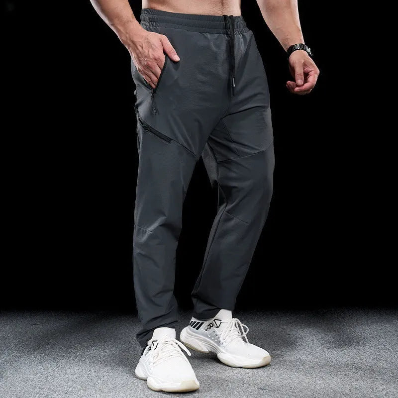 Men's waterproof quick-drying nylon workout pants in multiple colours for sports and fitness