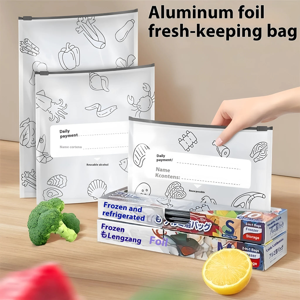 Set of resealable aluminium foil fresh-keeping bags in small, medium, and large sizes on a kitchen counter.
