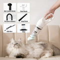 Cordless electric pet hair absorber with 28000Pa suction, white colour, shown on a sofa