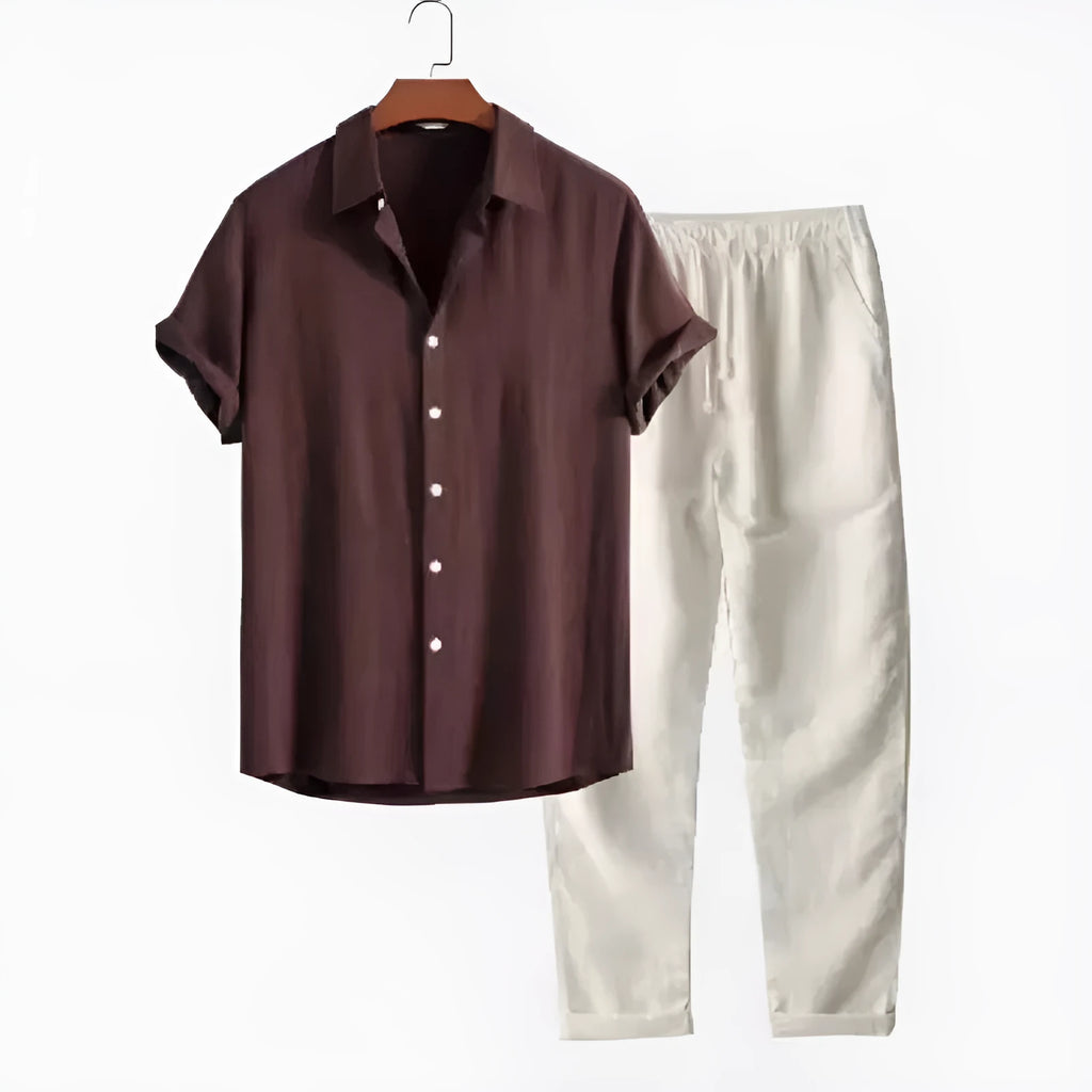 Man wearing a loose-fit light blue linen-blend short sleeve shirt and matching casual trousers.