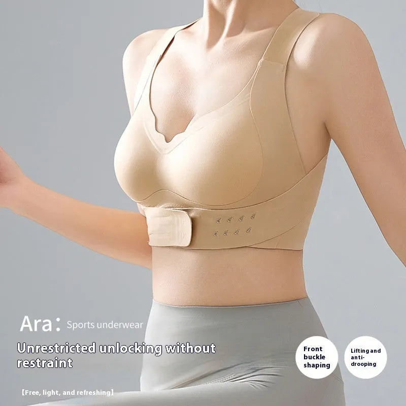 Women's black yoga bra with front buckle closure and supportive back design.