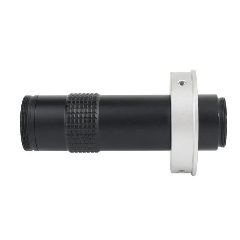 Black industrial monocular camera lens for 0.1-1.3X magnification with 60-300mm working distance.