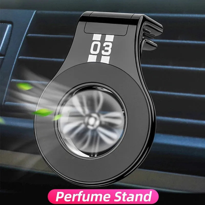 Black magnetic car phone holder attached to car air vent with phone mounted and adjustable rotation