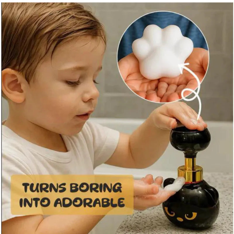 Black plastic cartoon cat shaped manual soap dispenser, 18cm tall.