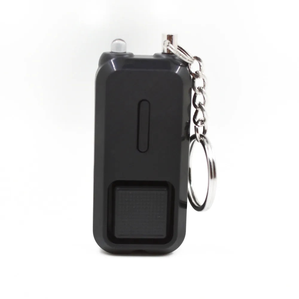 Pink personal safety alarm device measuring 65x30mm with keychain attachment