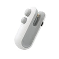 White handheld USB rechargeable heat sealer with cutter blade on a kitchen counter