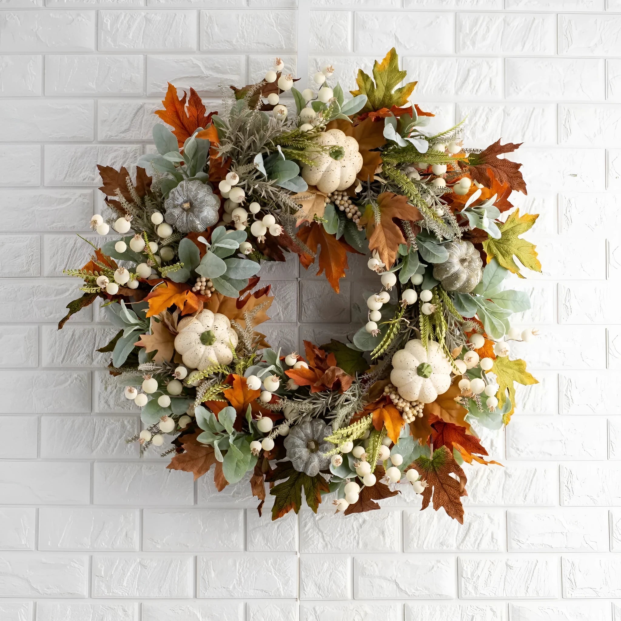 Pumpkin wreath with simulated frost leaves and pumpkins on a rattan ring base, 45x45cm size