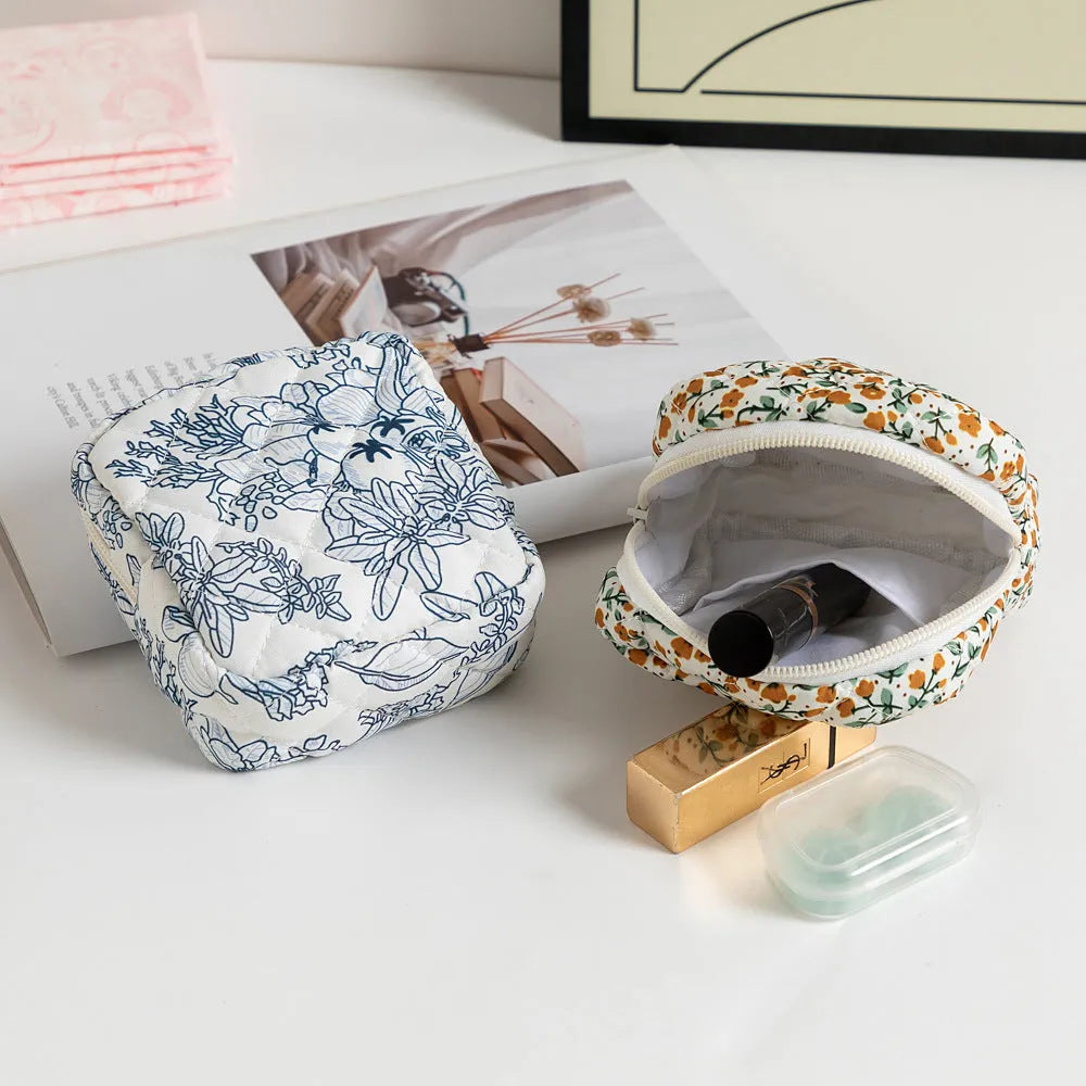 Yellow floral print polyester women's key storage bag with sewing thread details