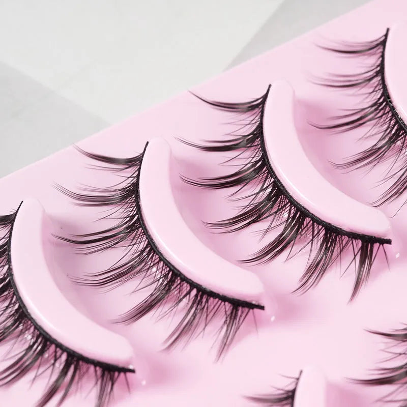 Set of manga-style false eyelashes showing three wispy designs with black plastic bands.
