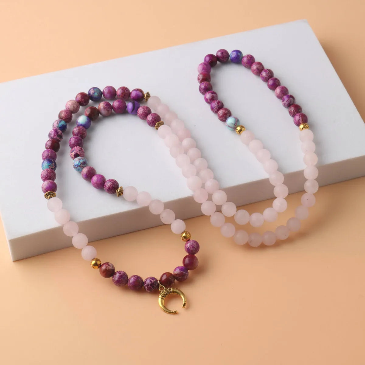 Pink crystal Emperor Stone round pendant necklace on a casual chain
