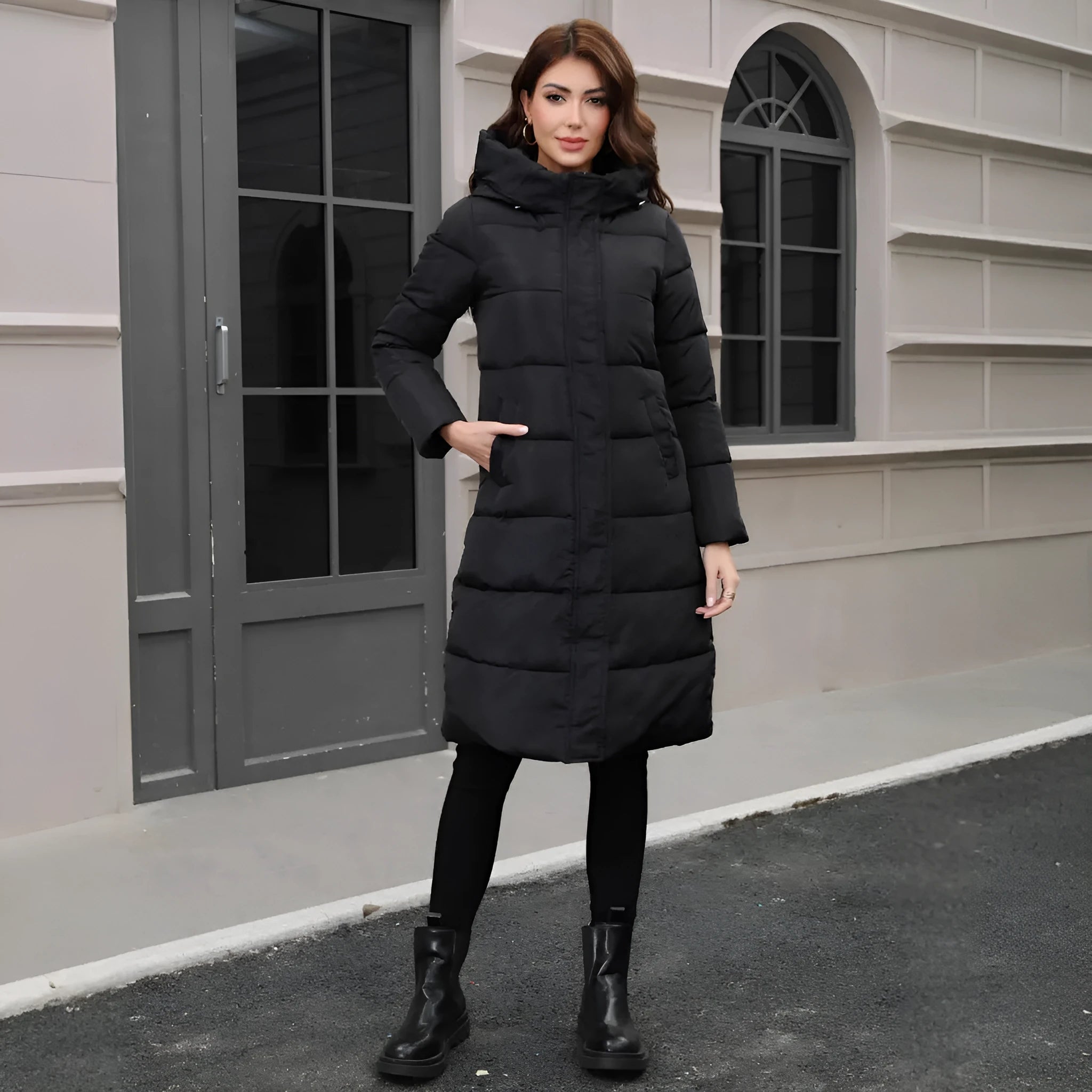 Black slim-fit men's hooded cotton jacket for cold weather, shown on a model.