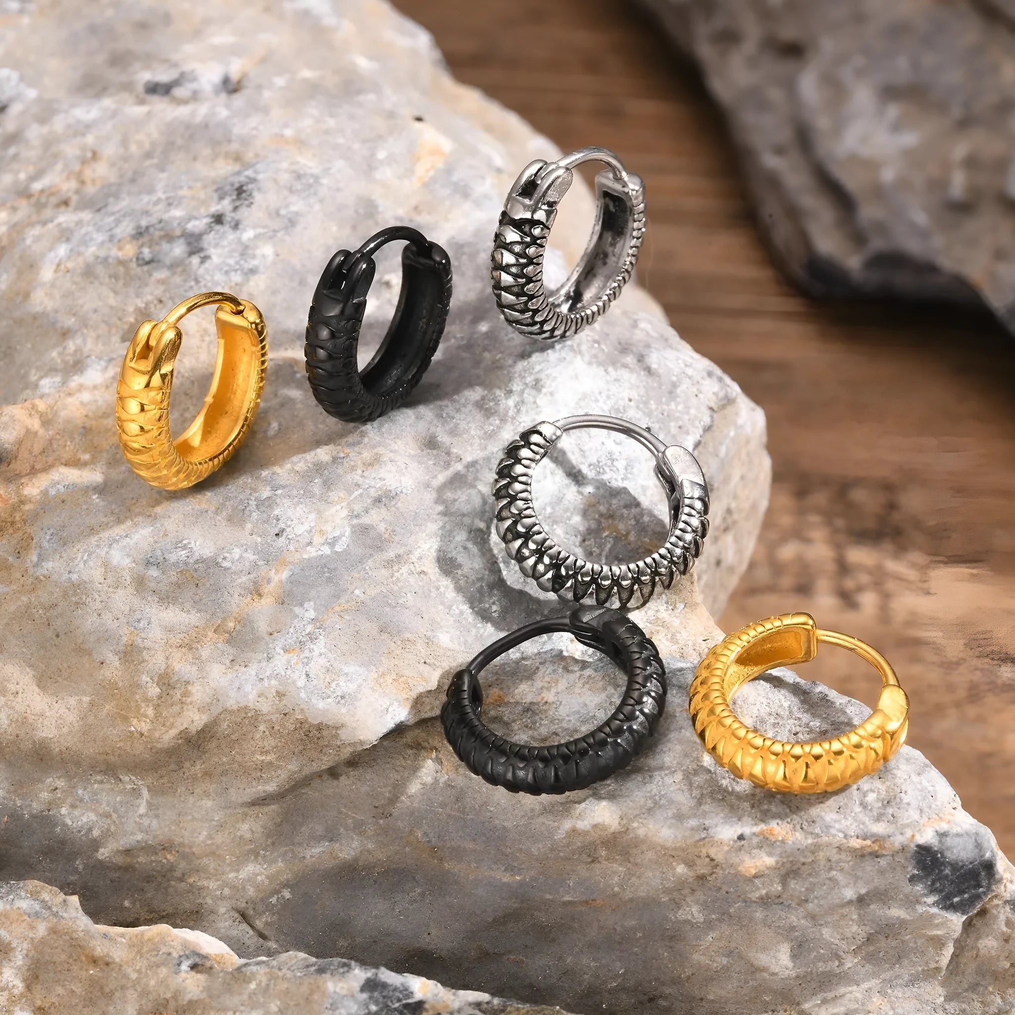 Stainless steel snake pattern drop hoop earrings in black and gold colours
