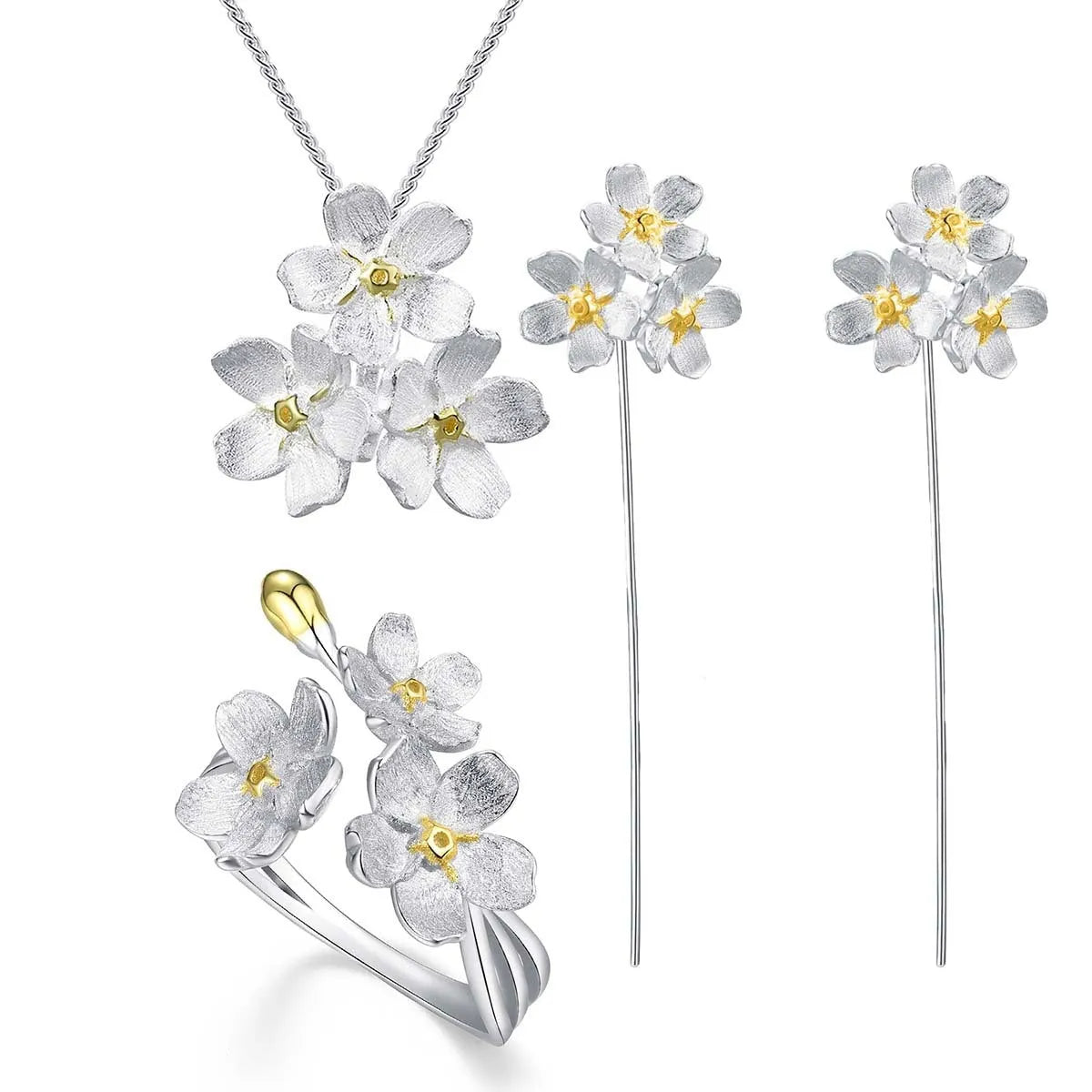 Hand-designed sterling silver forget-me-not flower pendant in pastoral style on a dark background.