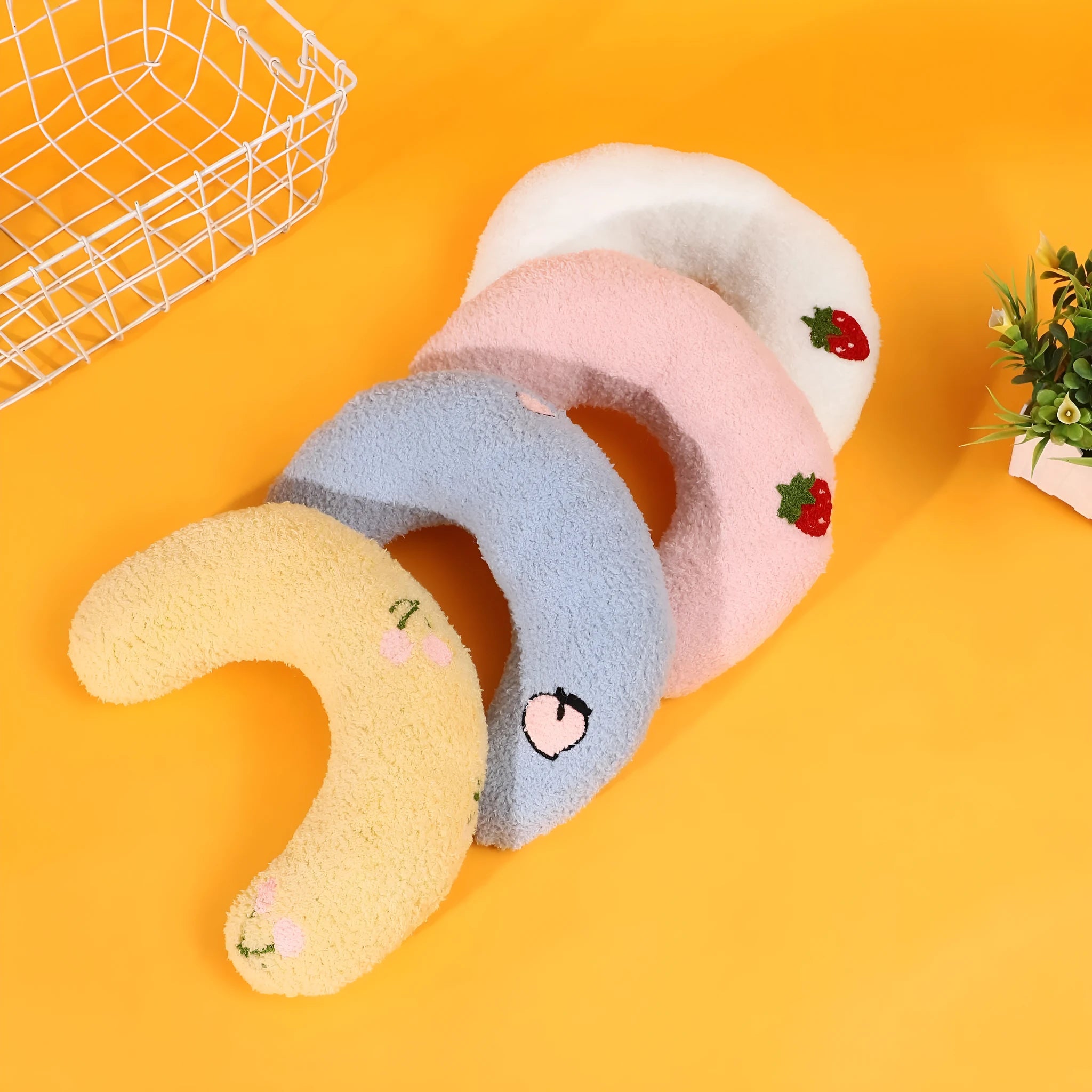 Colourful half moon U-shaped cloth pillow for cats and small dogs to sleep on.
