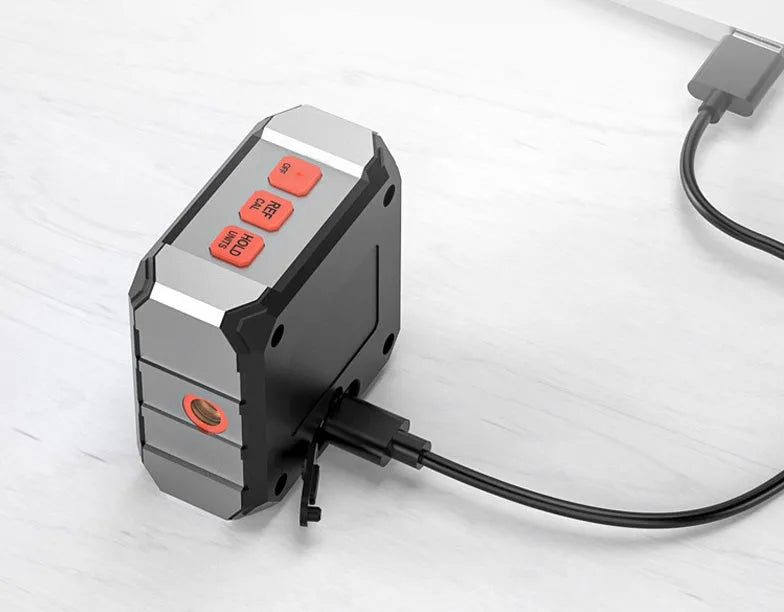 Black digital laser infrared tape measure with alloy casing and backlit display screen.