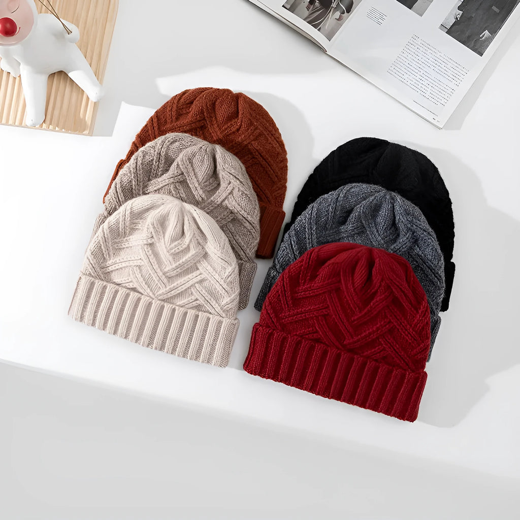 Women's wool knitted dome hat in various colours showing textured knit pattern and totem design elements