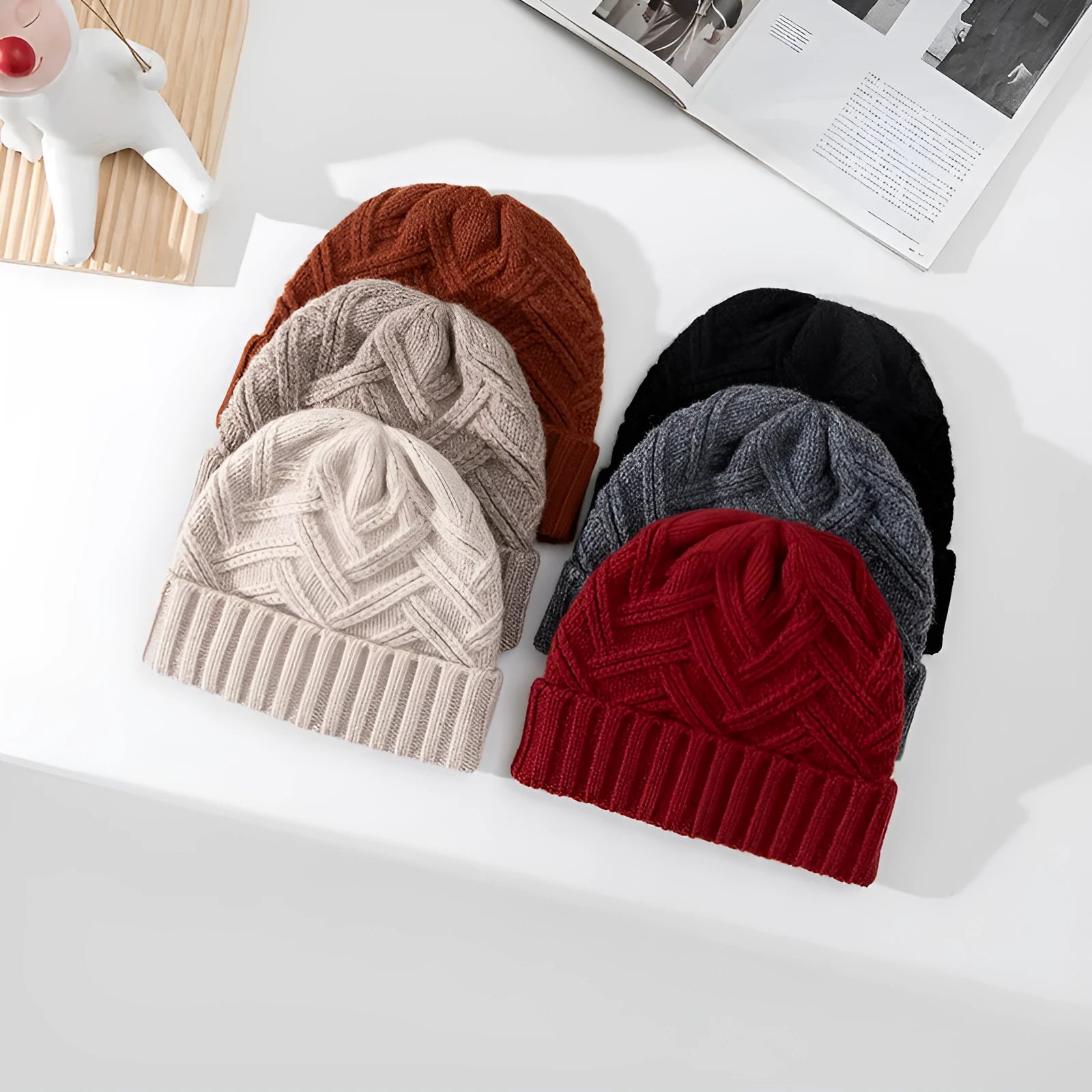 Women's wool knitted dome hat in various colours showing textured knit pattern and totem design elements