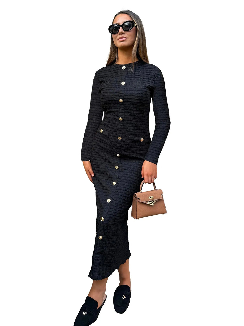 Black knitted long-sleeved slim fit dress with button detail on a mannequin.