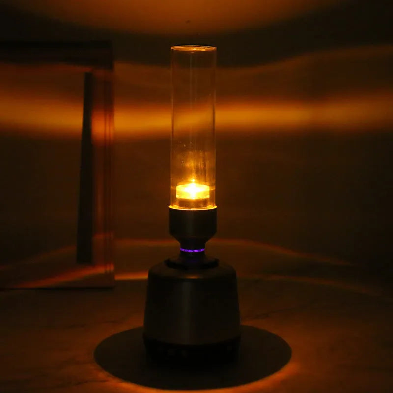 White silver Bluetooth speaker with candlelight atmosphere lighting showing modern minimalist design