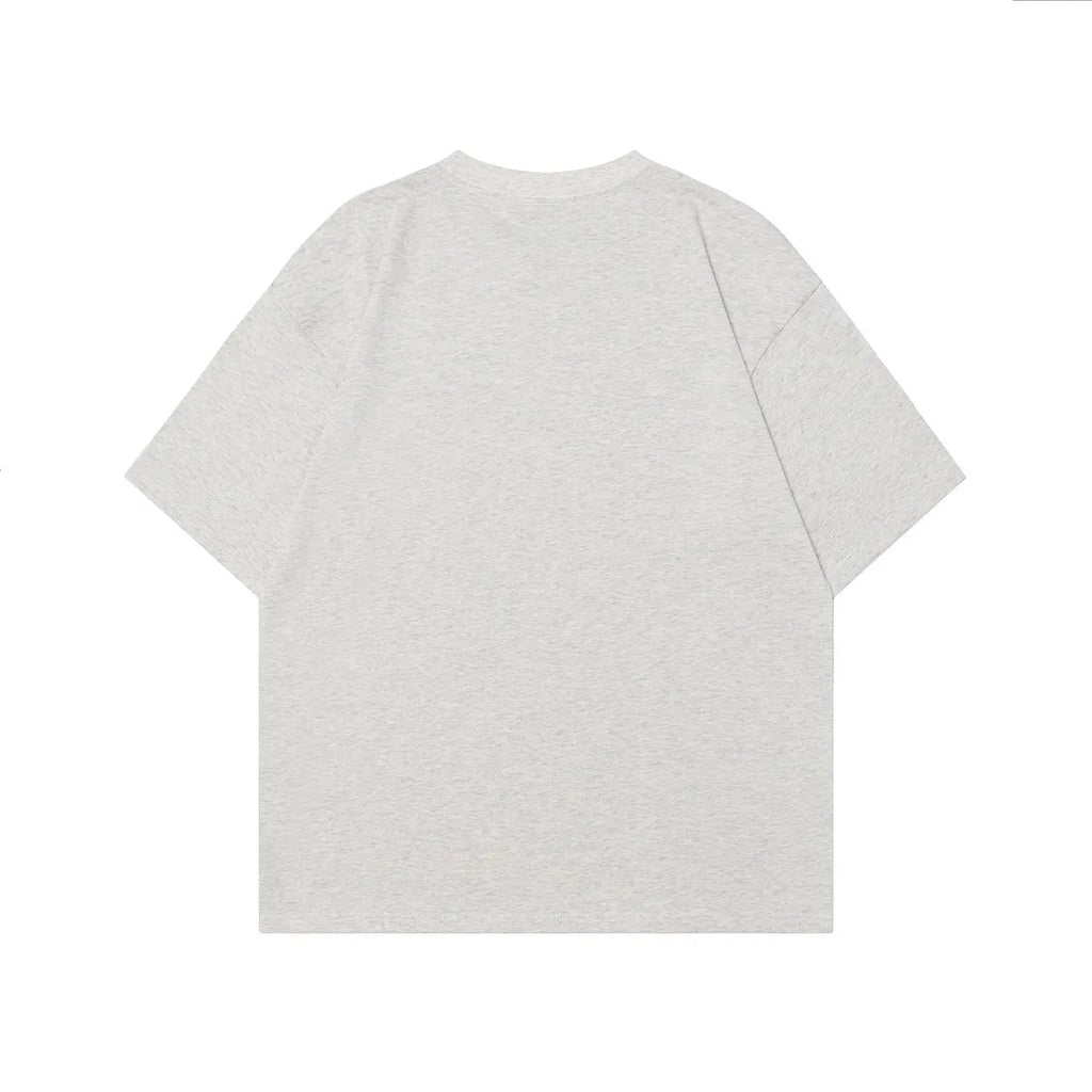 Men's grey cotton t-shirt with retro character print showing short sleeves and loose fit