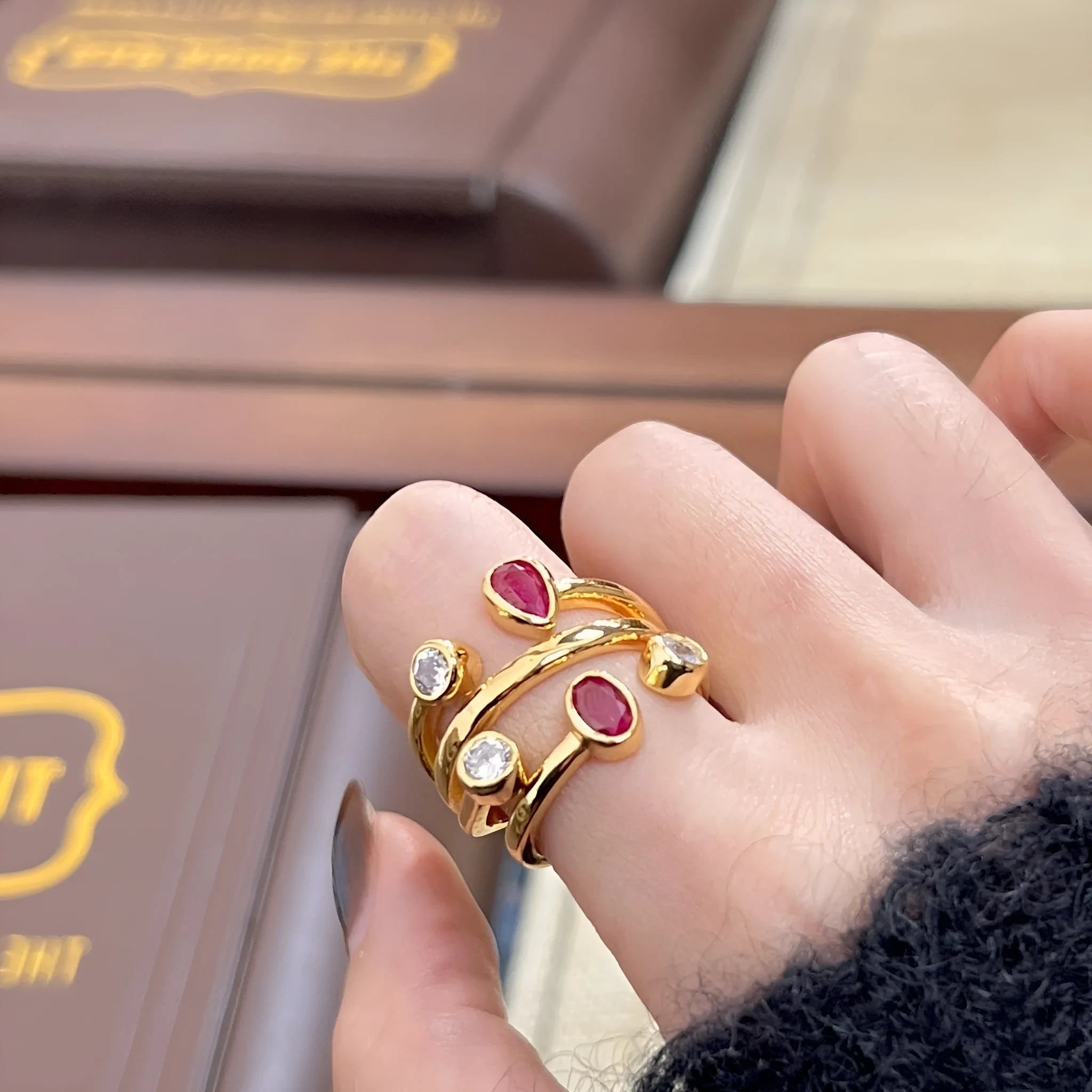 Copper geometric ring with irregular crossed design and grouped diamonds in two-tone colours