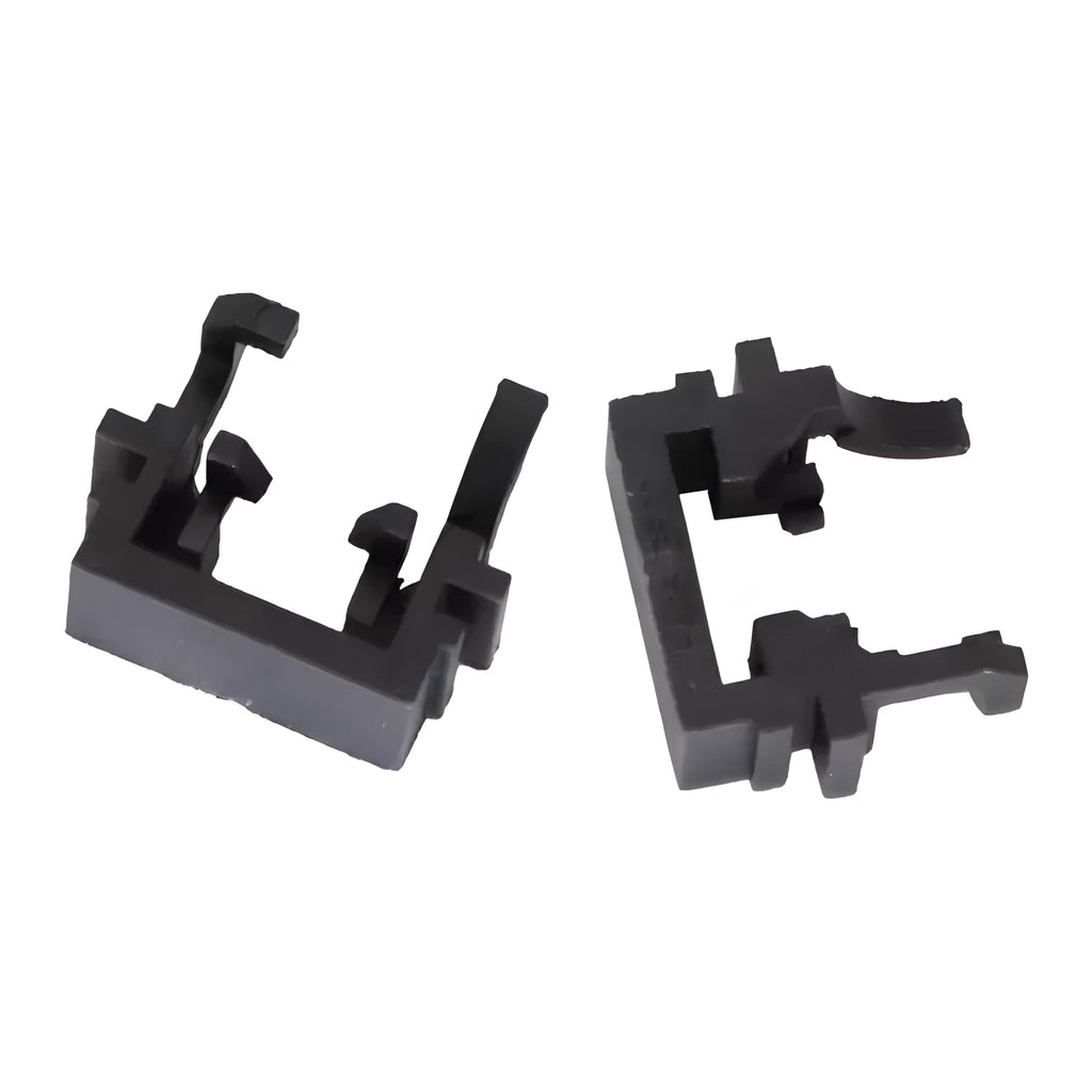 Black plastic LED headlight adapter holder for Ford cars, shown next to a ruler for scale.