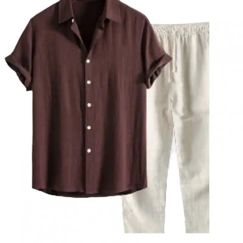 Man wearing a loose-fit light blue linen-blend short sleeve shirt and matching casual trousers.