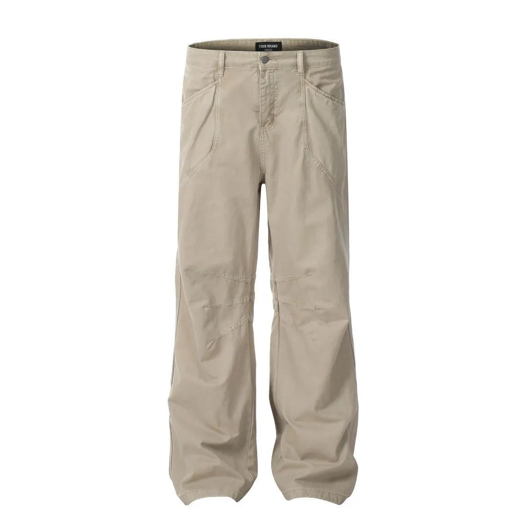 Men's loose straight-leg cotton trousers in brown colour with a high waist and wide leg opening.