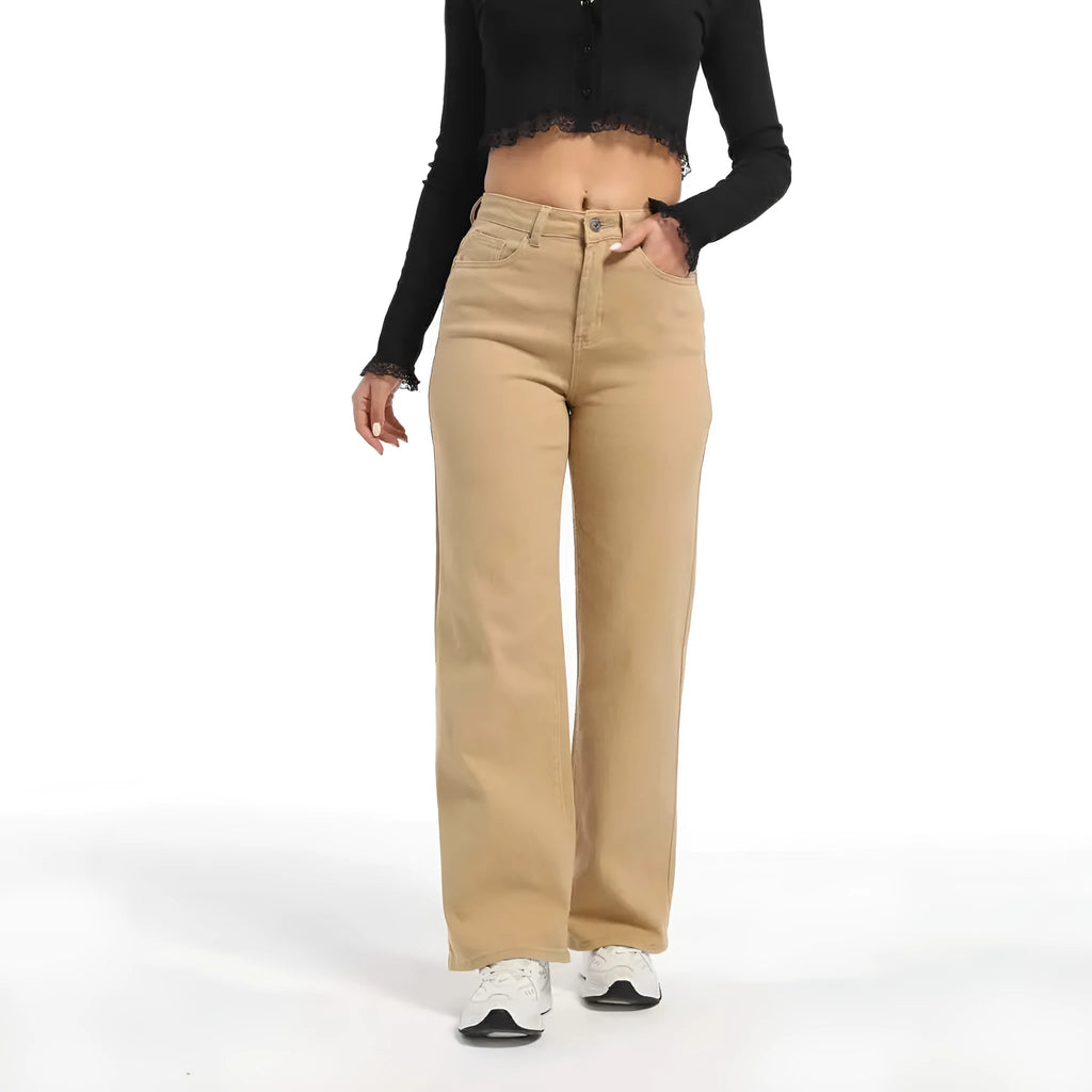 Women's high waist wide leg jeans in apricot colour on a hanger.