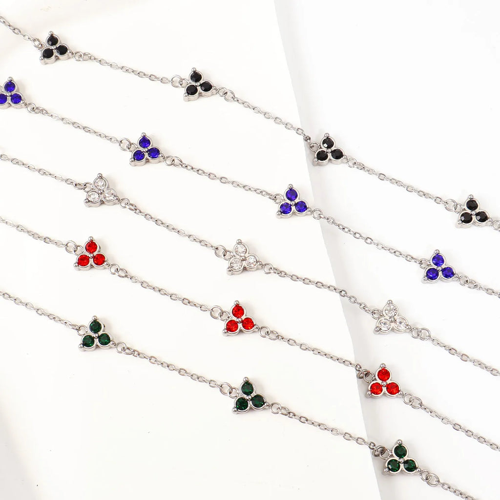 Stainless steel women's bracelet with three triangular zircon stones in a choice of colours and metal finishes.