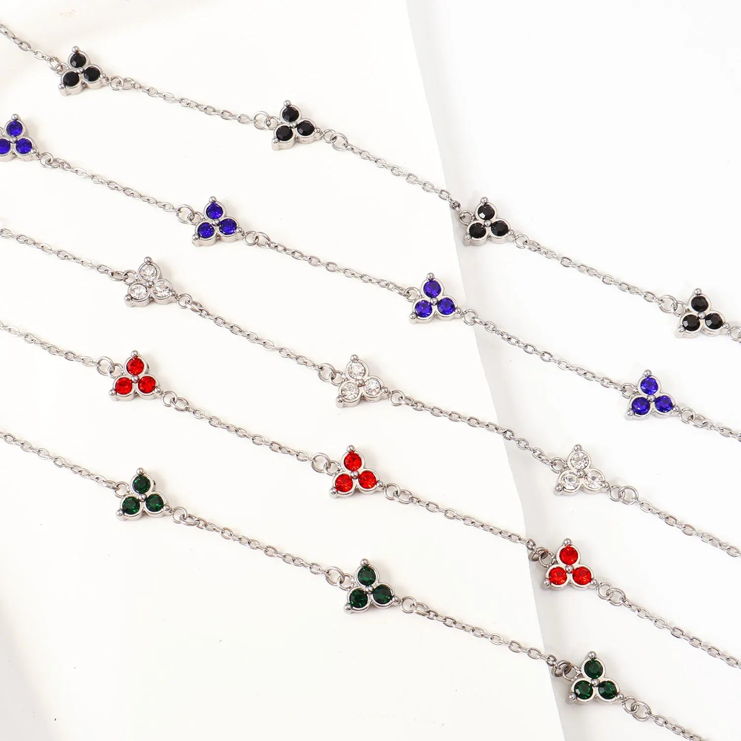 Stainless steel women's bracelet with three triangular zircon stones in a choice of colours and metal finishes.