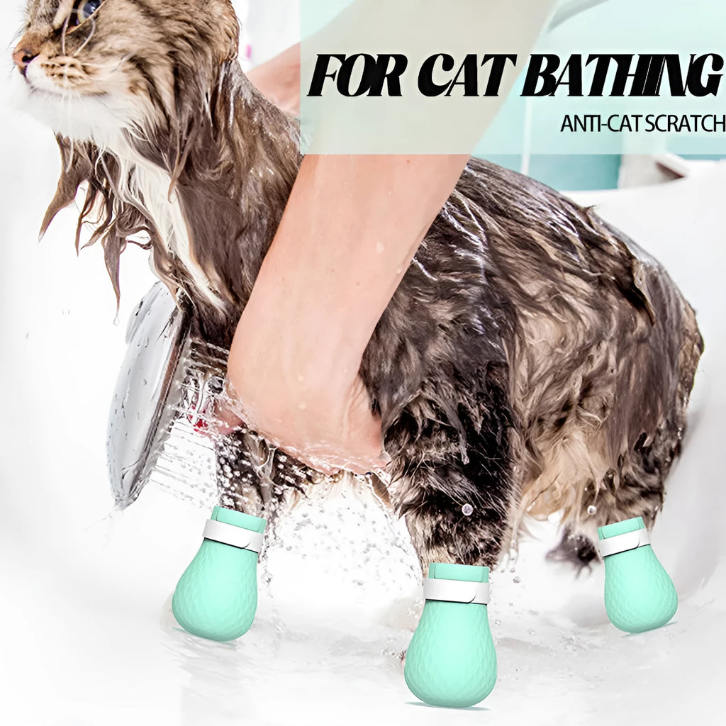 Set of four green silicone cat paw covers designed as anti-scratch gloves for pet washing and medication