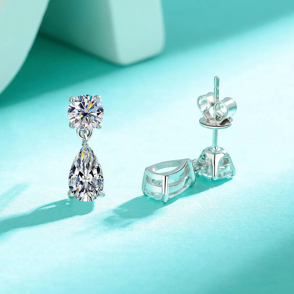 Women's geometric moissanite stud earrings with round and water drop stones in 925 sterling silver