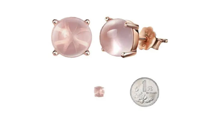 Rose gold coloured drop shaped stud earrings for women with a synthetic quartz stone.