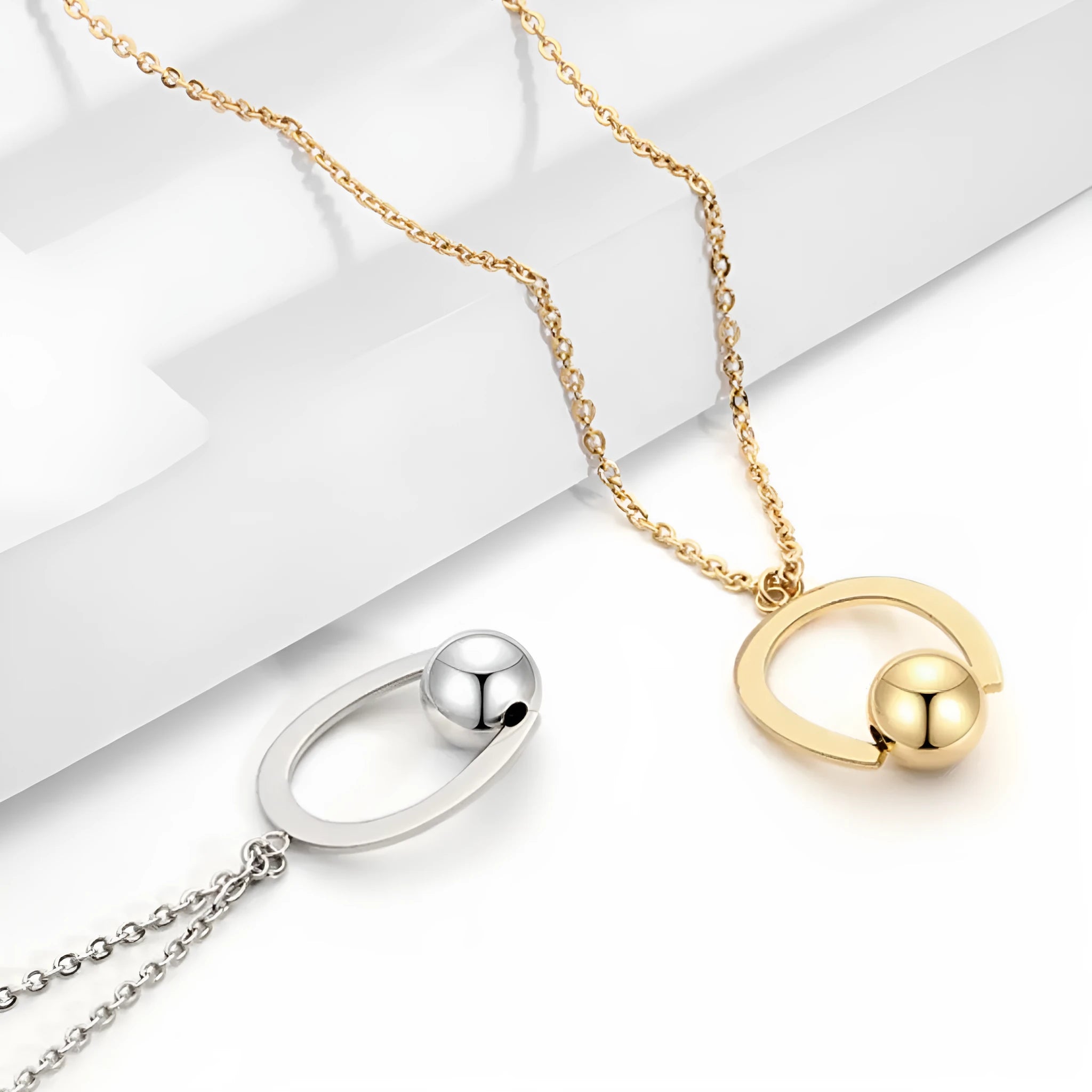 Stainless steel bead chain necklace with geometric pendant on cross chain