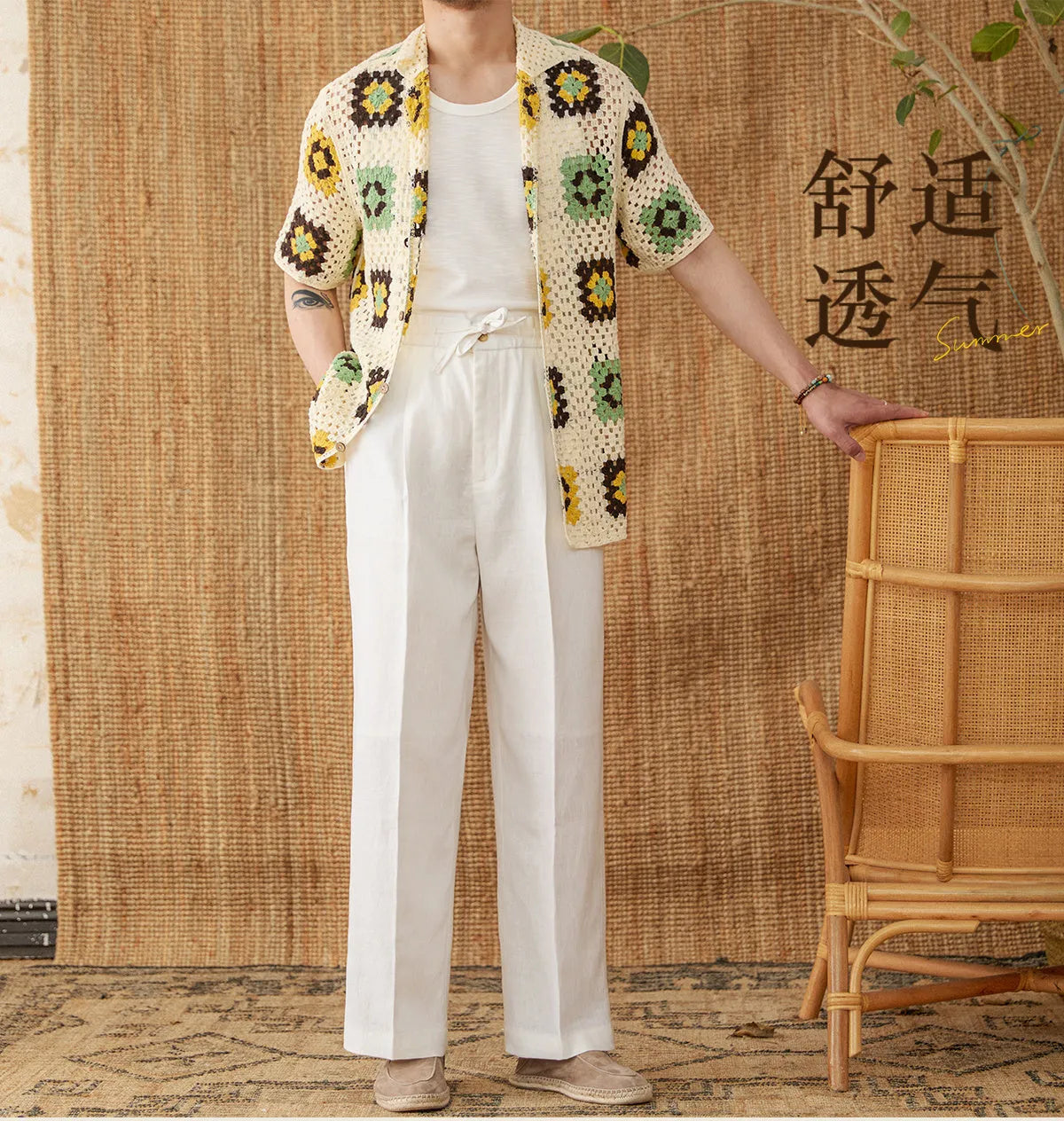 Straight-leg linen trousers in greige colour with a high elasticated waistband on a hanger.