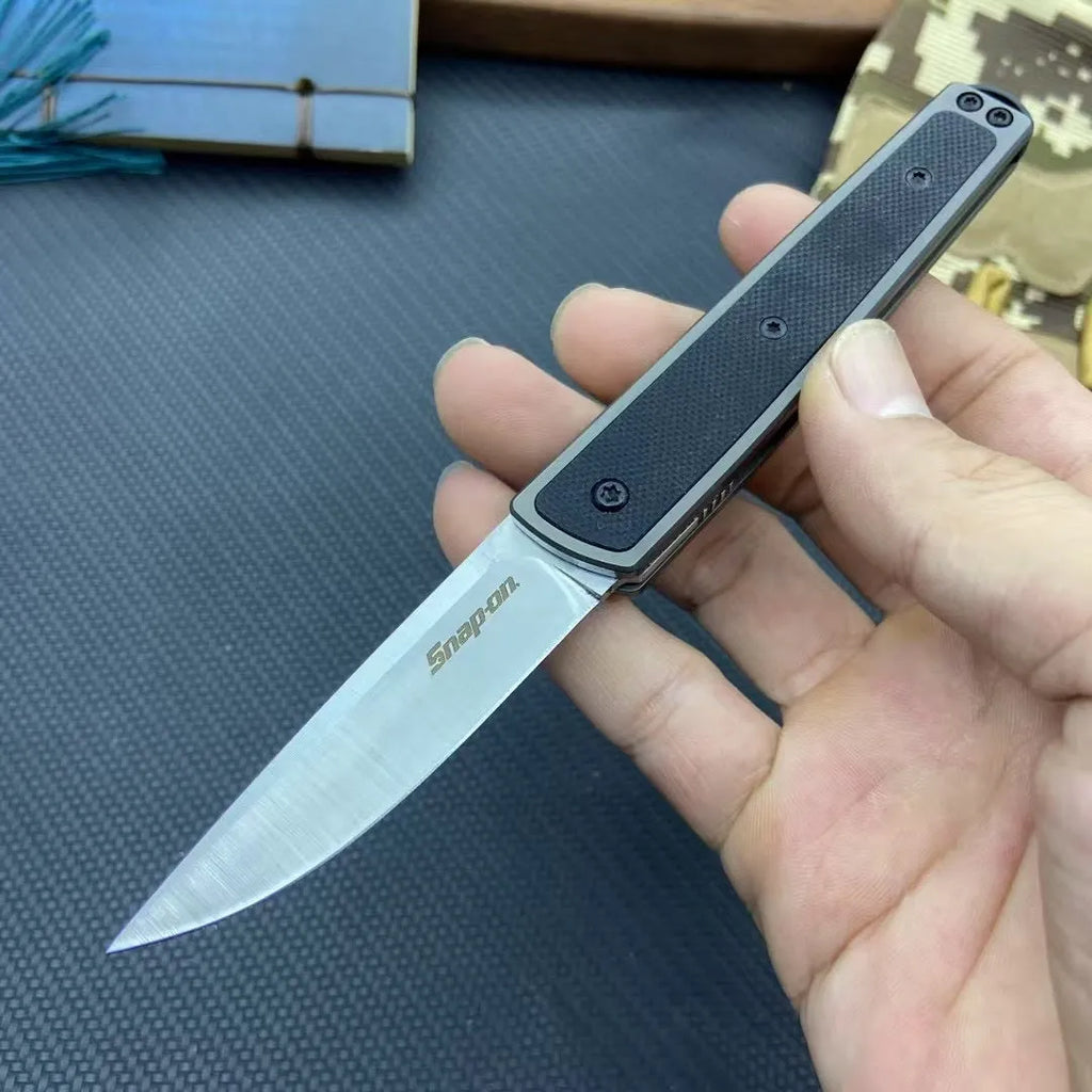 CRKT 7190 folding fruit knife showing black stainless steel blade and handle with dimensions displayed