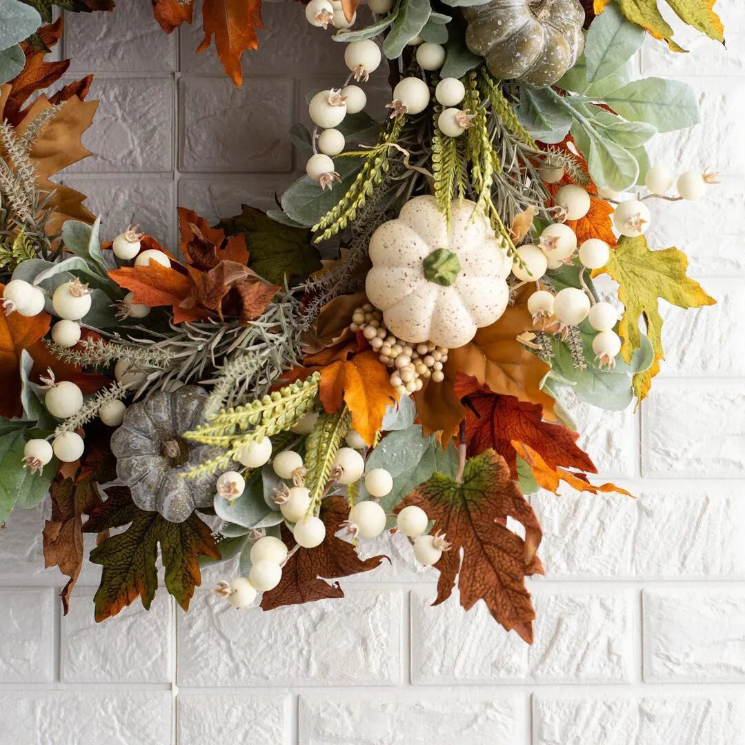 Pumpkin wreath with simulated frost leaves and pumpkins on a rattan ring base, 45x45cm size