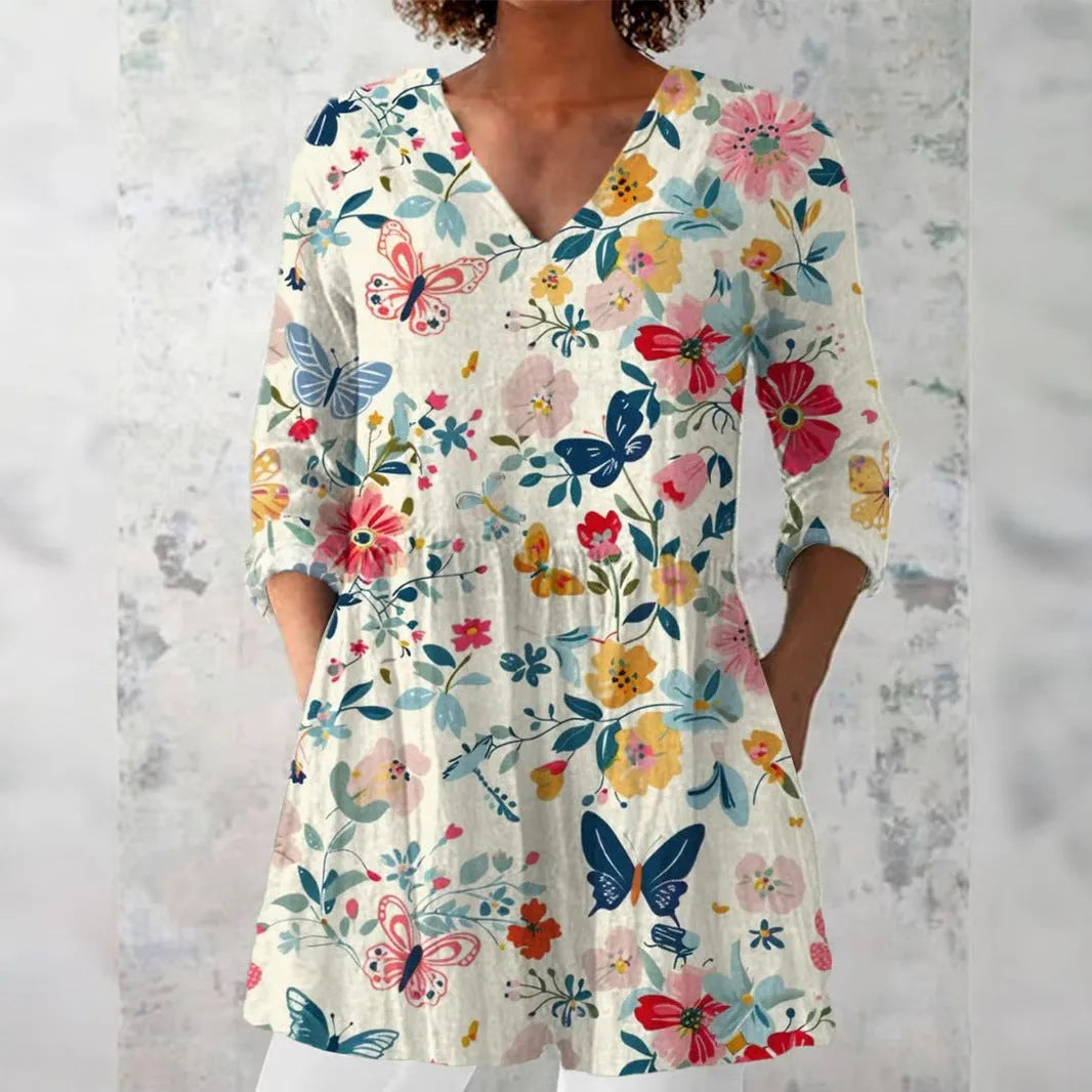 Women's retro-style slim fit long-sleeved top with a printed pattern, shown in one of twelve available colours.