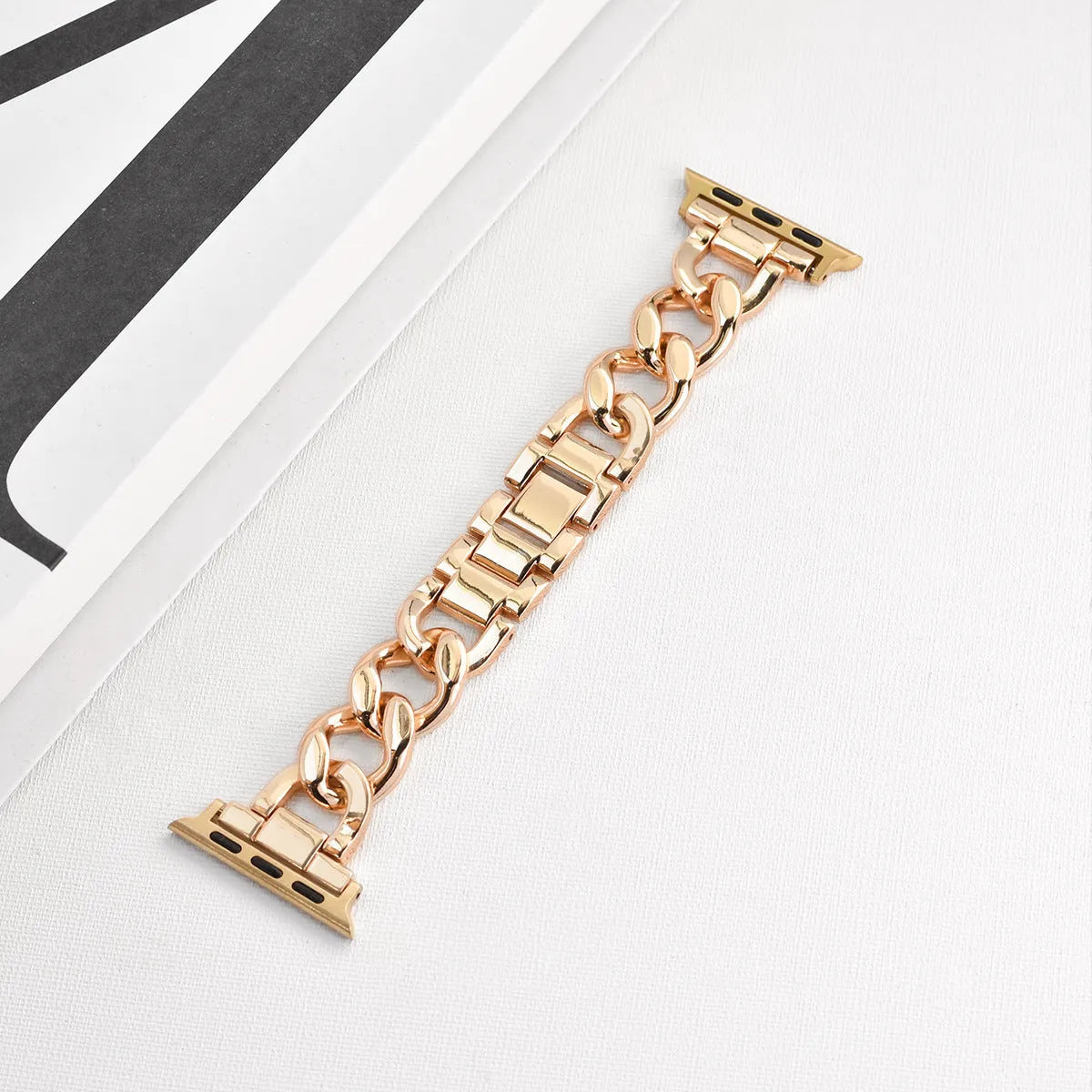 Metal chain link watch strap for Apple Watch in silver, black, gold, rose gold, or Starlight colour.