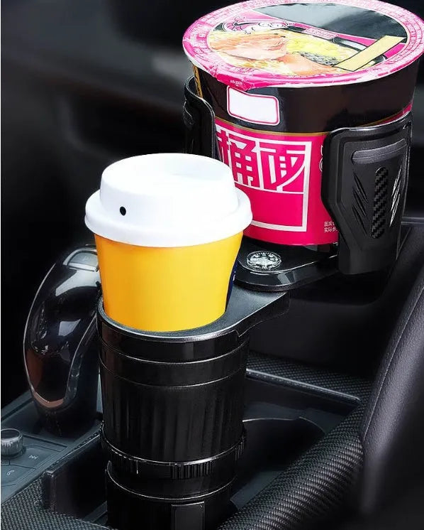 Black retractable car water cup holder with adjustable base on a car centre console.