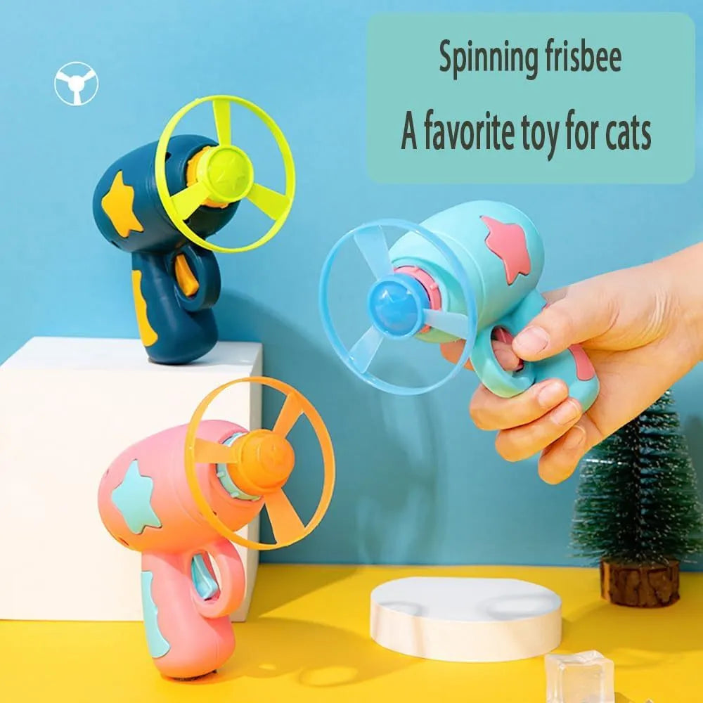 Blue or pink plastic cat toy gun launcher with two coloured frisbees for indoor play.