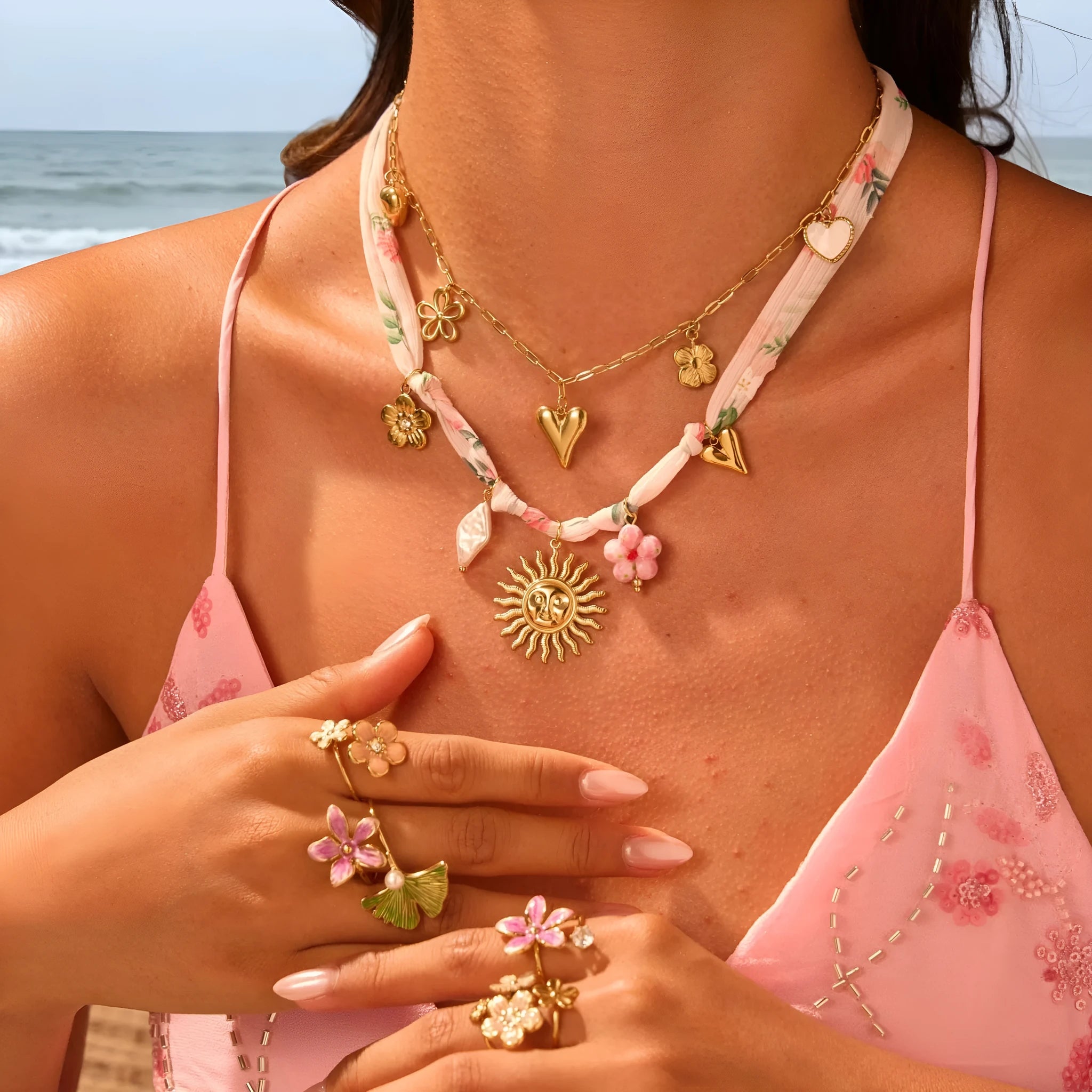 Gold plated stainless steel necklace with a geometric sun pendant on an adjustable chain.