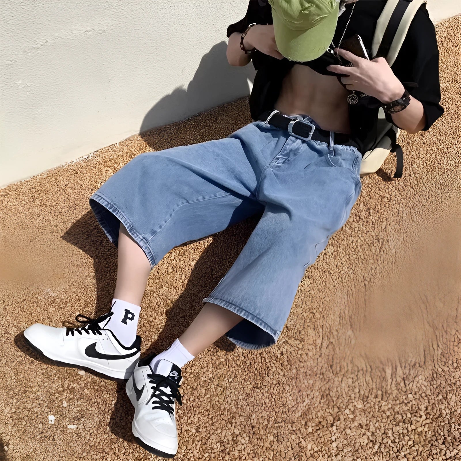 Blue men's high-waist washed denim pirate shorts with a cropped length and straight leg.